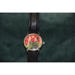 A wristwatch The red and green face depicting chairman Mao with Arabic hour markers.