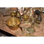 A collection of various brass metal wares To include a brass jam skillet, two brass milk pans, a
