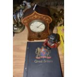 A mixed group of collectable items To include a stamp album of British stamps, a cast iron money box