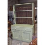 A Victorian painted pine dresser The open back with two shelves above an associated chest with a