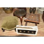 Three assorted stools To include an ebonised Victorian footstool raised on scroll toes, a mahogany