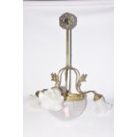 A Victorian style gilt metal and frosted glass light fitting The frosted glass shade suspended