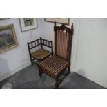 A Victorian oak prie dieu chair Having a leaf carved pediment above a padded back flanked by