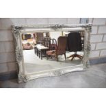A large and impressive Rococo style wall mirror, late 20th Century The substantial, rectangular