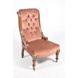 A Victorian walnut and upholstered ladies nursing chair The button padded back flanked by curved