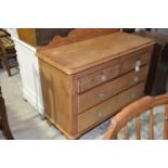 A Victorian pine chest of drawers Having a shaped back above a rectangular top with rounded front