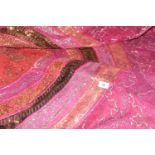 A vibrant Indian wall hanging / throw The sequined throw decorated in pinks, orange, gold, green and