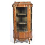 An exceptional 19th Century French Kingswood vitrine The shaped cabinet applied overall with