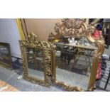 A French Rococo style gilt wood framed wall mirror, 20th Century Having a scrolling leafy frame