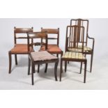 A pair of Regency mahogany dining chairs Each with a rope twist rail above a drop in seat and