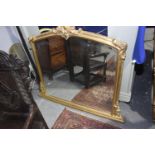 A Regency style gilt wood over mantle mirror, 20th Century Having a leafy shell crest above an