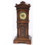 An early 20th Century mantle clock in the form of a longcase clock Having an architectural case with