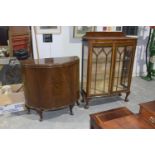 An early 19th Century mahogany bow front display cabinet Having a gadroon border above two