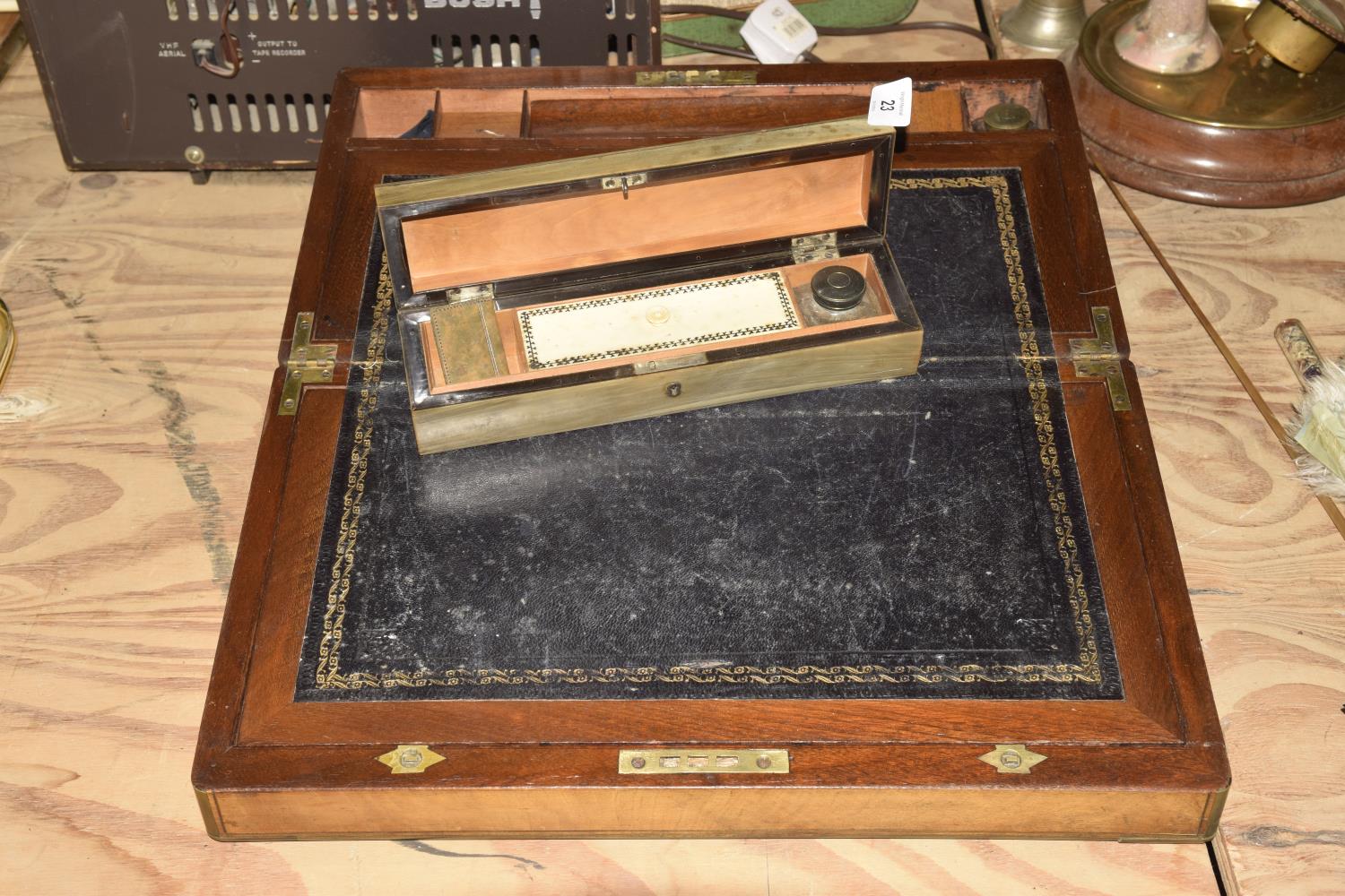 A Victorian walnut stationary box Of hinged form with a leather inset writing slope and
