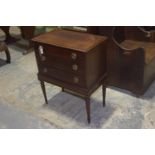 A 19th Century mahogany chest on stand Having a rectangular moulded and cross banded top above three