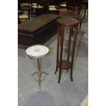 An Edwardian mahogany plant stand and a brass wine table The Edwardian plant stand with two circular
