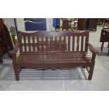 A painted hardwood garden bench Having a shaped top rail above a slatted back and slatted seat