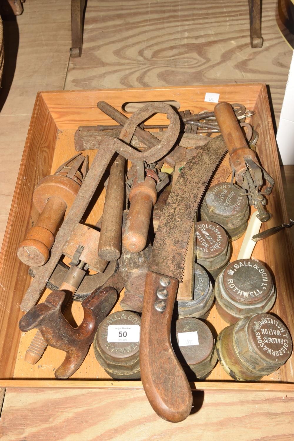 A mixed group of various tools and ephemera To include brass and wooden spirit level, 7 brass hub