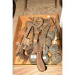 A mixed group of various tools and ephemera To include brass and wooden spirit level, 7 brass hub