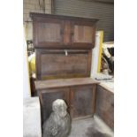 An unusual early 20th Century oak kitchen cabinet Having a moulded cornice above two cupboard