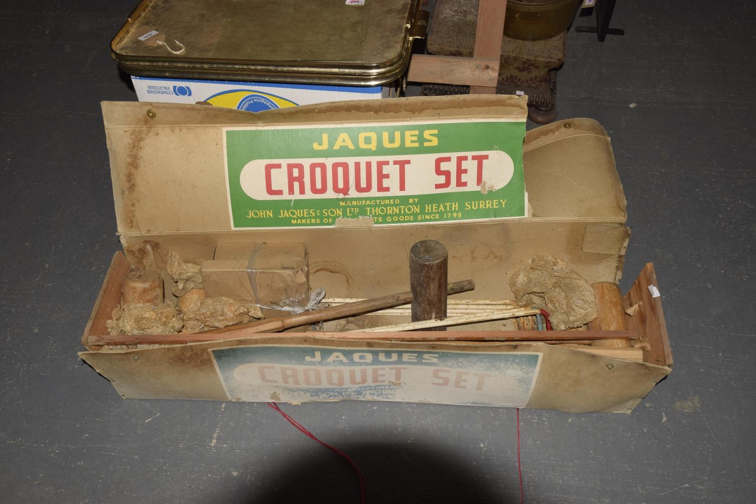 A Jacques Croquet set With five mallets and six metal croquet hoops all housed in original box.