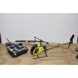 A radio controlled helicopter A Fly Dragonfly 2005 battery operated with controller.