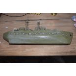 A mid 20th Century painted wooden scratch built model of a battleship Modeled with various guns
