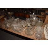 A large quantity of glassware To include celery vases, fruit bowls, plate mounted claret jug, candle