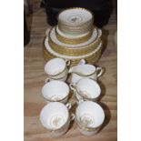 A Minton 'Gold rose' part dinner and tea service Comprising of eight tea cups, eight saucers, milk