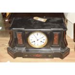A Victorian slate and rouge marble architectural mantle clock The substantial case inset with