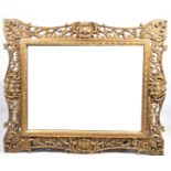 An impressive French Rococo style gilt wall mirror, 20th Century Having a rectangular beveled
