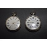 Two silver pocket watches Each with a circular white enamel dial and Roman numeral hour markers,