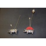 Two silver novelty pin cushions Each designed as a pig, with velvet pin cushion back, hallmarks