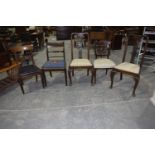 Five assorted dining chairs To include a George IV mahogany dining chair with armorial needlework