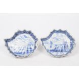 A pair of Dutch Delft dishes, 19th Century Each of leaf form, the central field detailed with