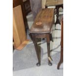 A Georgian mahogany oval drop leaf table Raised upon tapering cylindrical legs with pad feet, 98cm