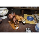 A Beswick prowling Cheetah The Cheetah measures 30cm in length together with a matt glazed chestnut,