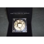 A copy Waterloo Medal and set of Royal Mail Mint stamps, c.2015 Queen Elizabeth II £5, cashier G M
