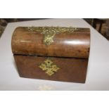 A wooden and brass bound box The rounded cover revealing empty compartment applied with Gothic