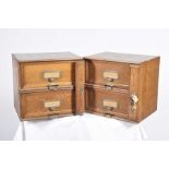 A pair of Stolzemberg oak two drawer desk top cabinets, early 20th Century Each cabinet with two