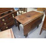 A 19th Century oak drop leaf dining table The rectangular top supported on legs of tapering square