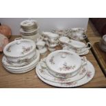 A Royal Albert 'Moss Rose' tea and dinner service Comprising four teacups, six saucers, milk jug,