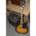 A Gibson copy electric guitar by Aria Fitted with two pick ups on a Sunburst ground along with a