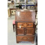 A 19th Century mahogany bureau The rectangular top with an openwork brass gallery above a fall front