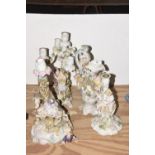 A collection of three Meissen style porcelain candle holders and a Meissen style porcelain jug To