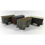 Four good quality 'O' gauge closed wagons In LMS livery believed to be by Bassett-Lowke