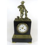 A late 19th Century French figural mantel clock The circular white enamel dial with Roman numerals