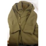 A British Army Great Coat with Gloucester Regiment buttons, mid 20th Century The shoulder tabs