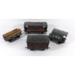 Four good quality unboxed 'O' gauge rolling stock Comprising two break vans, open timber wagon and