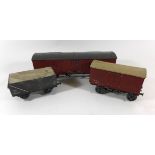 Three good quality unboxed 'O' gauge wagons Two covered and one uncovered and one large example, all